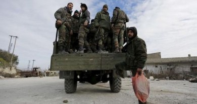 قوات موالية للرئيس السوري بشار الأسد على متن شاحنة عسكرية